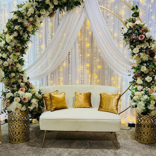 Circular floral stage with white drapery