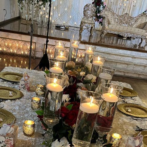 Long table with candles and gold chargers